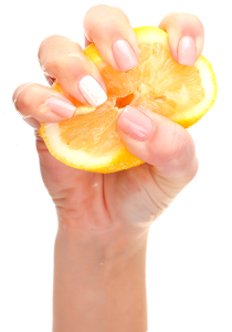 A hand squeezing a lemon